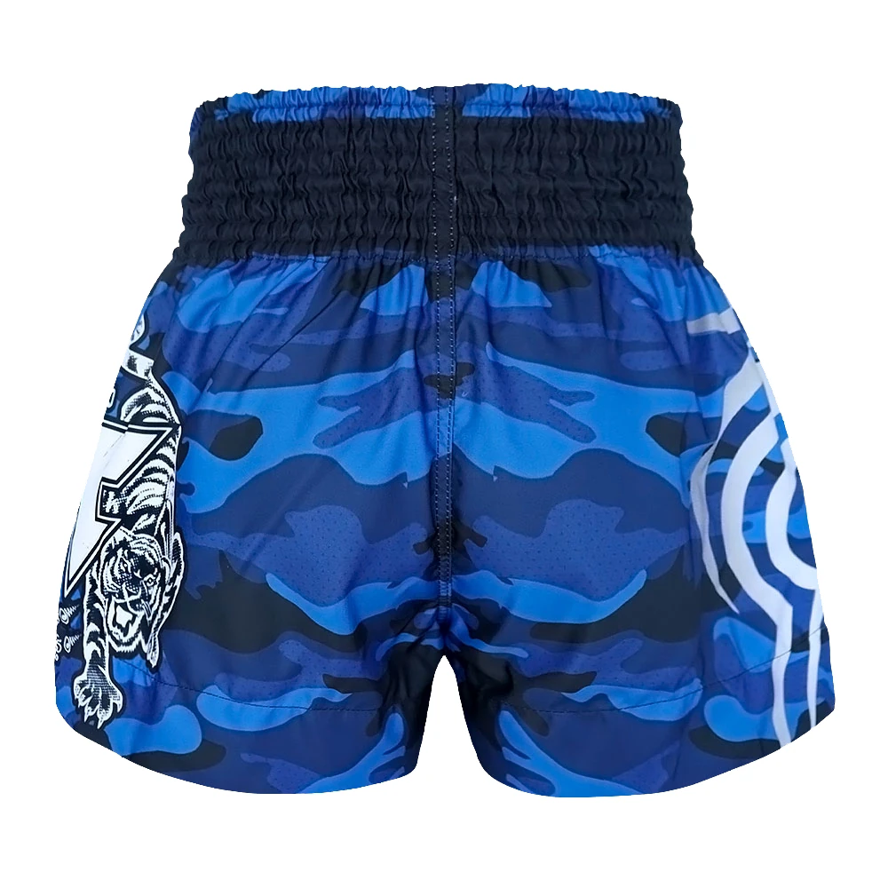 Blue camouflage thai shorts with tiger design on a white background