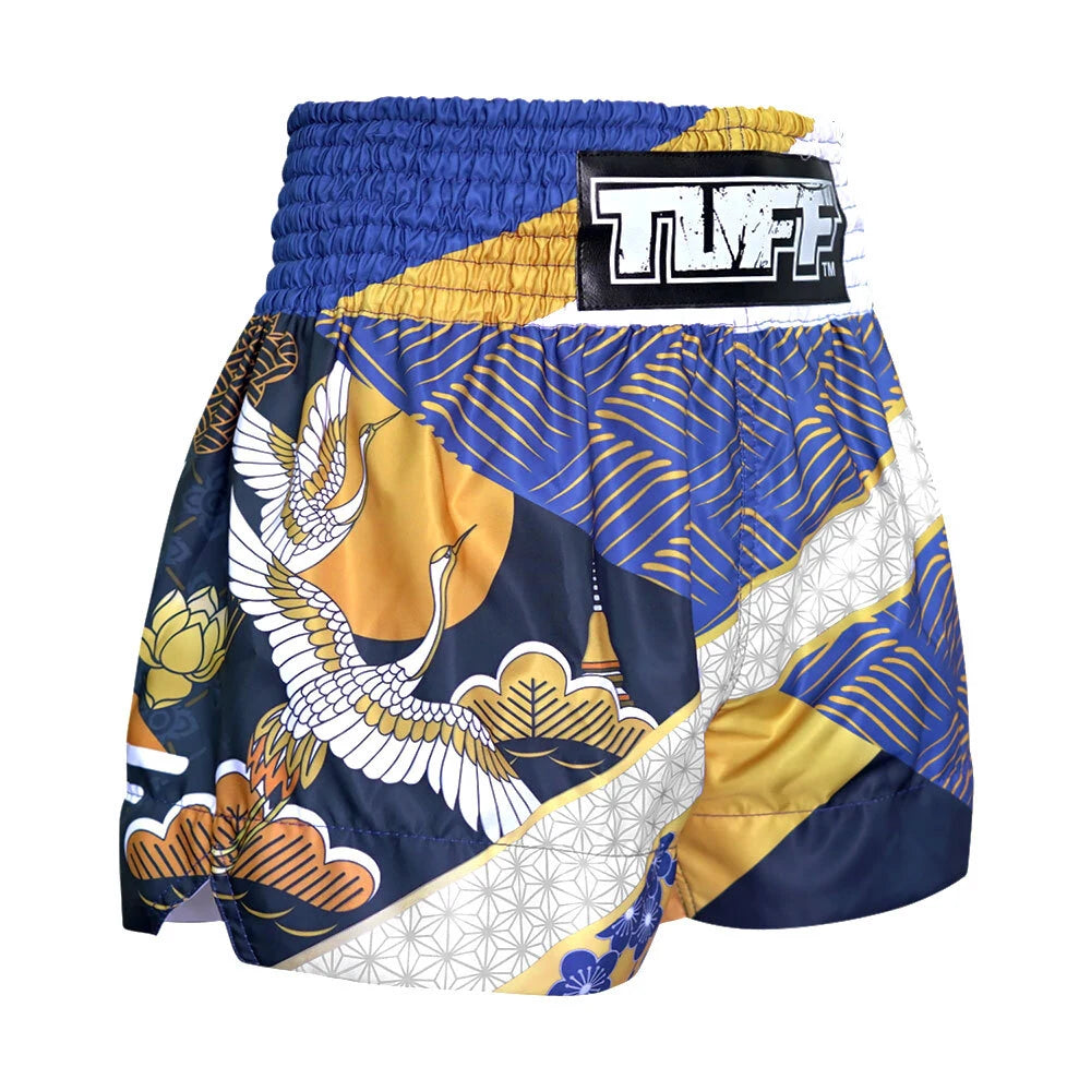 Traditional Japanese Muay Thai boxing shorts with crane and floral patterns on a white background
