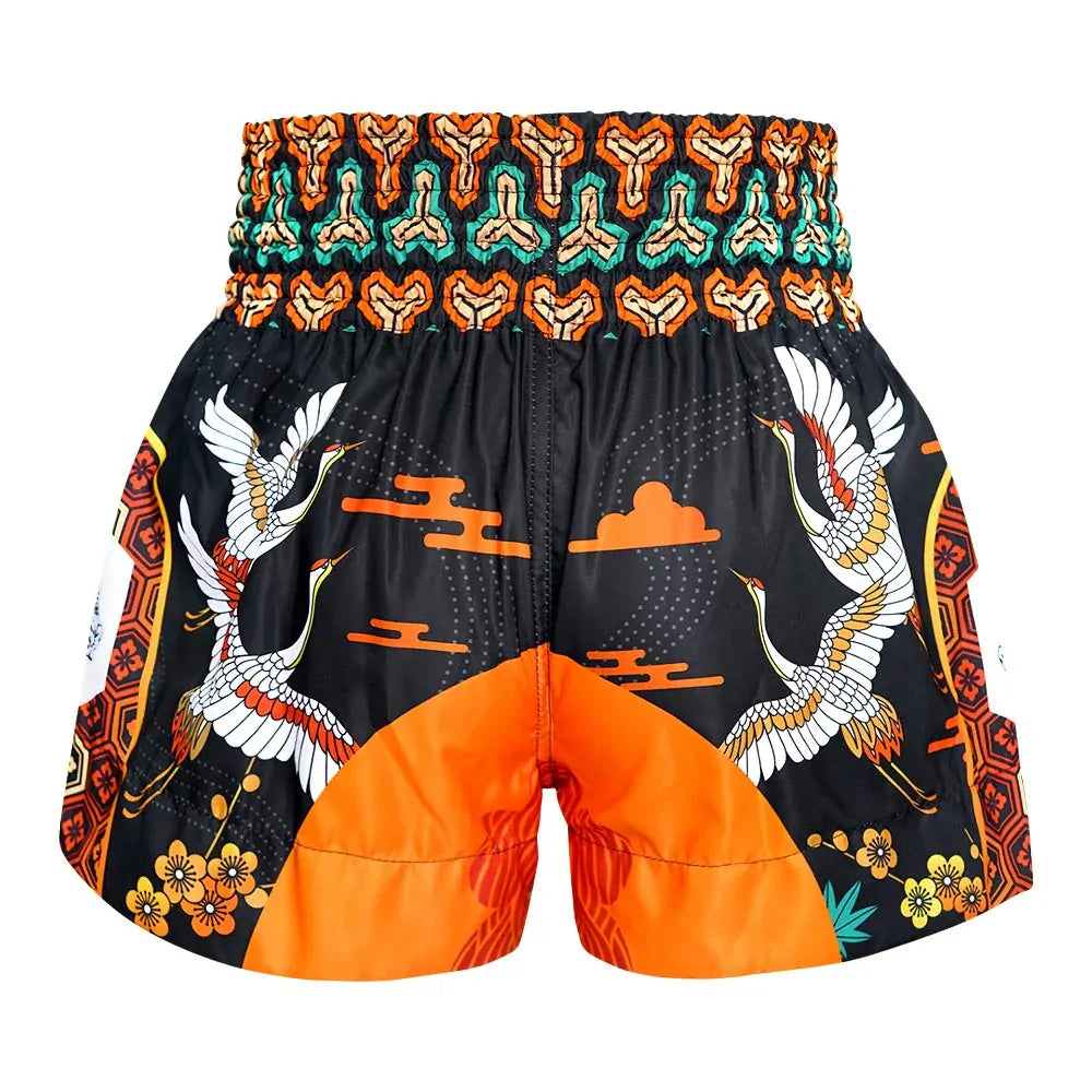 Colorful Muay Thai shorts with crane design on a white background
