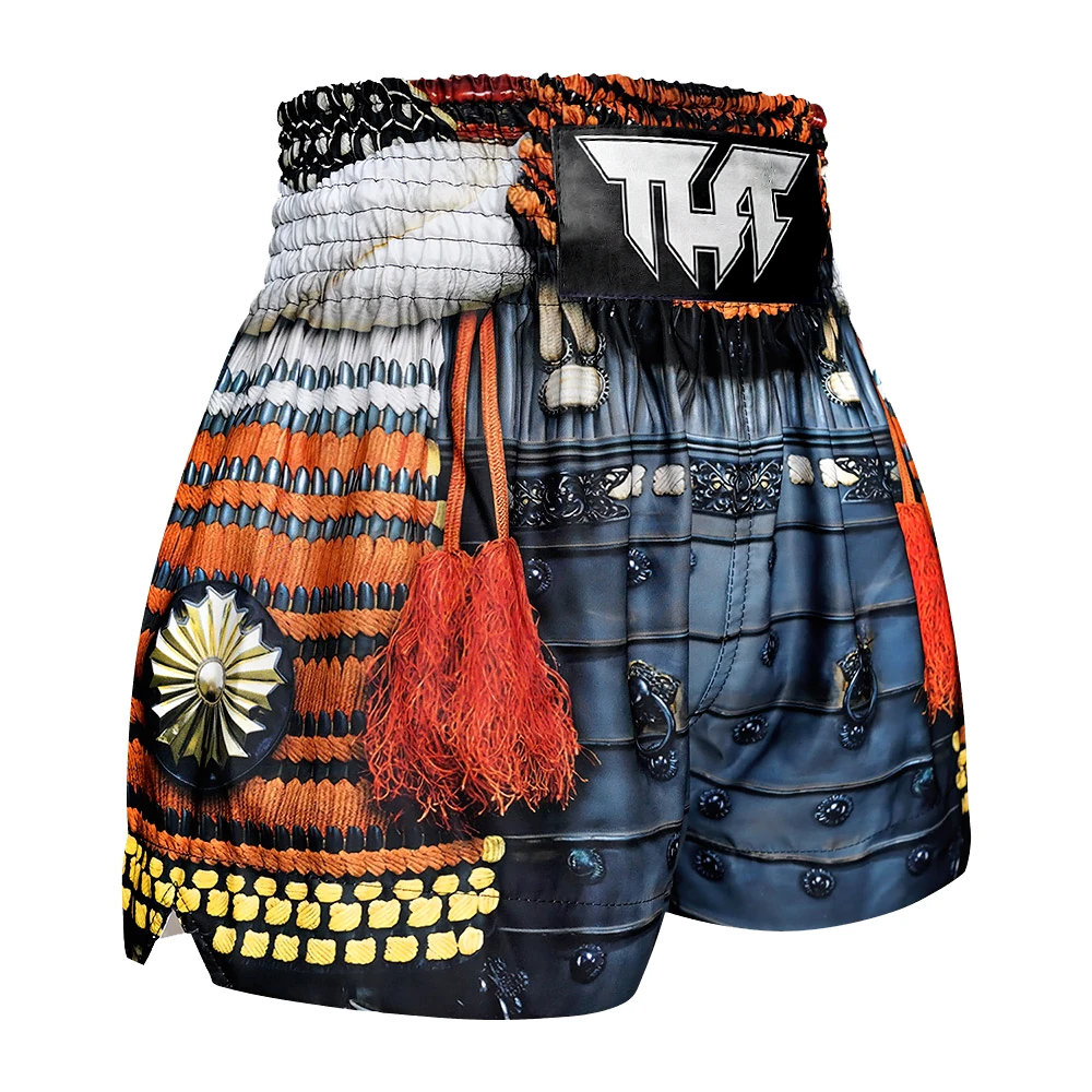 Colorful Muay Thai shorts with intricate designs and decorative elements on a white background