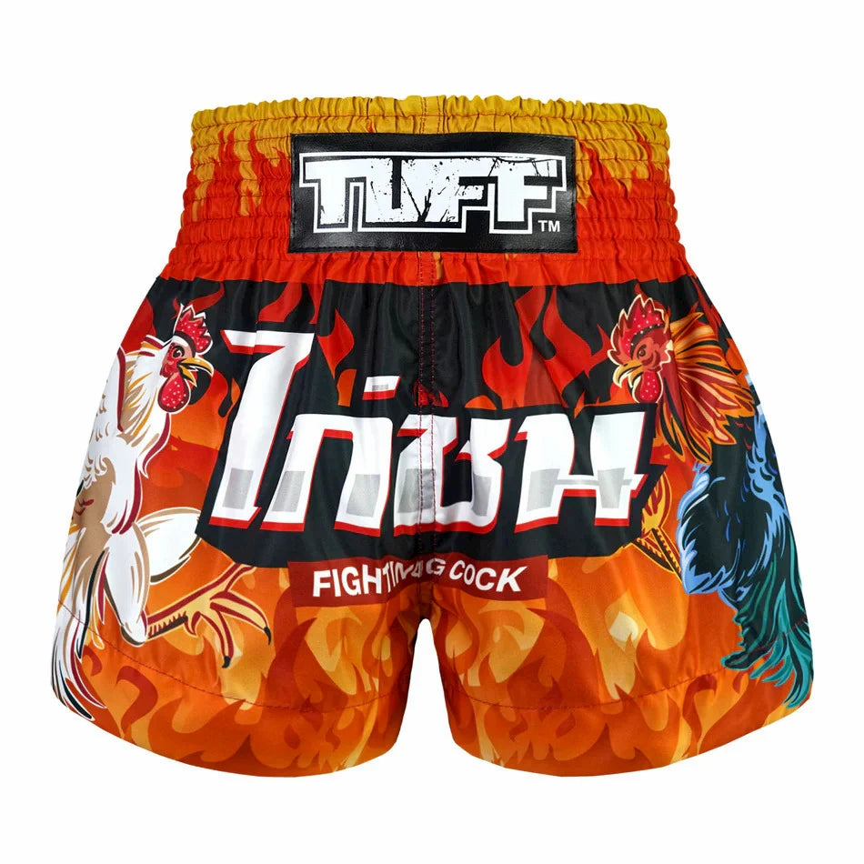 Colorful thai shorts with rooster design and 'TUFF' branding on a white background