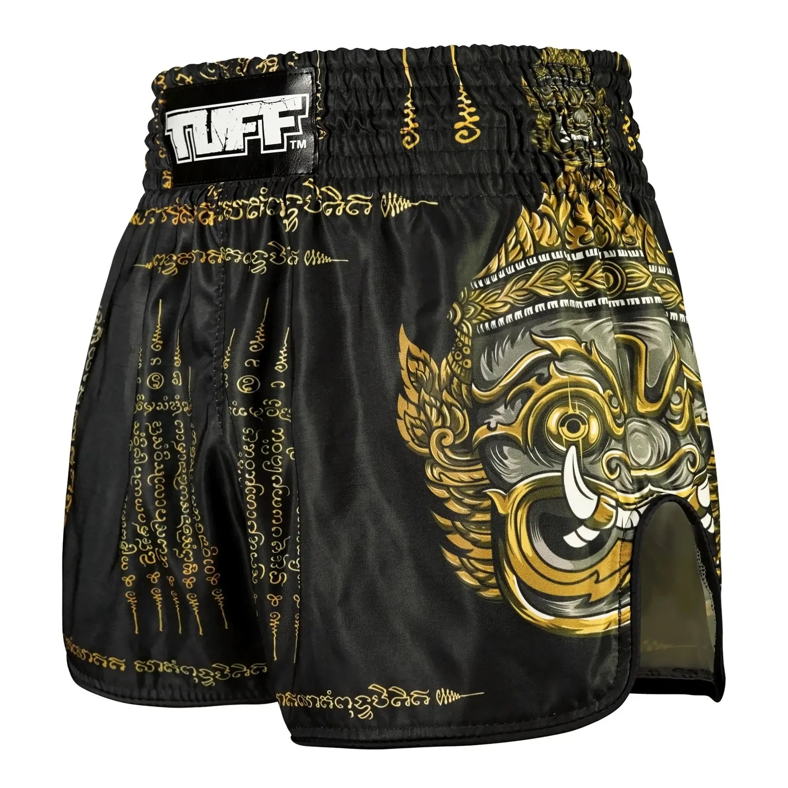Black and gold Muay Thai shorts with a dragon design on a white background