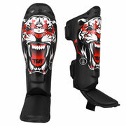 Black shin guards with a tiger design on a white background