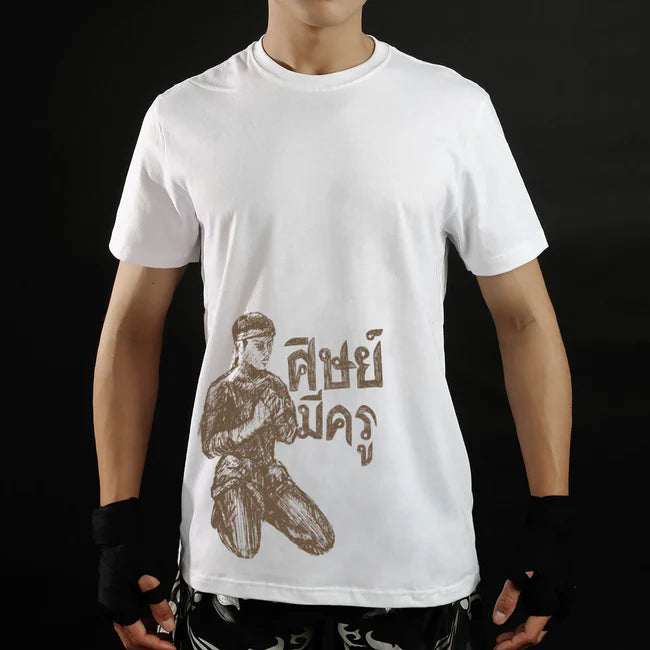 Person wearing a white t-shirt with a graphic design on a black background