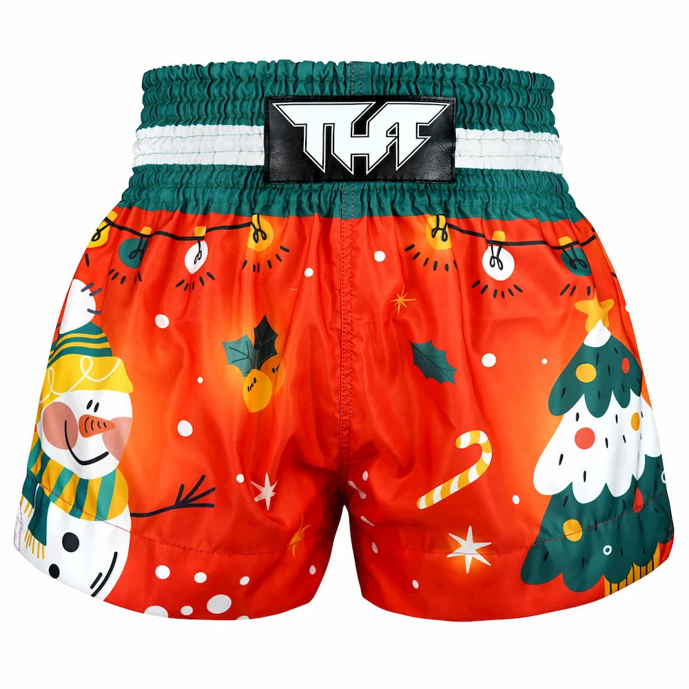 Christmas-themed Muay Thai shorts with festive designs on a white background