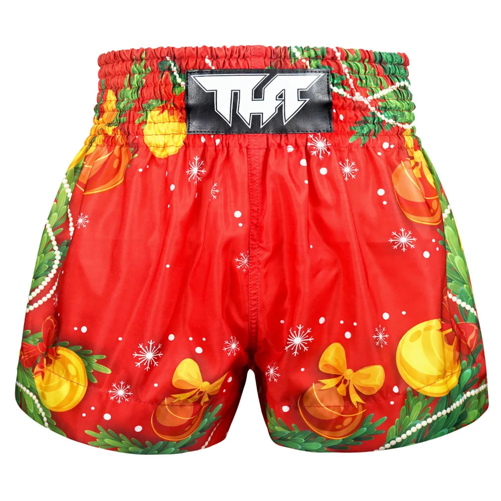 Red Muay Thai boxing shorts with Christmas-themed decorations on a white background