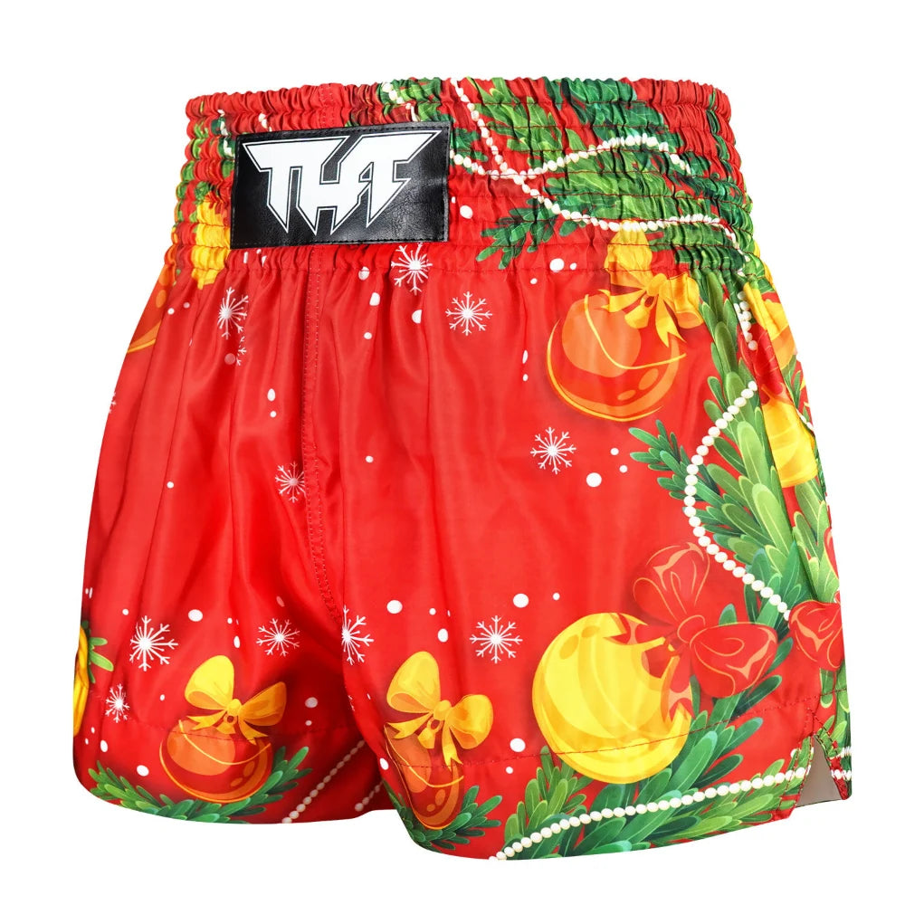 Red Muay Thai boxing shorts with Christmas-themed decorations on a white background