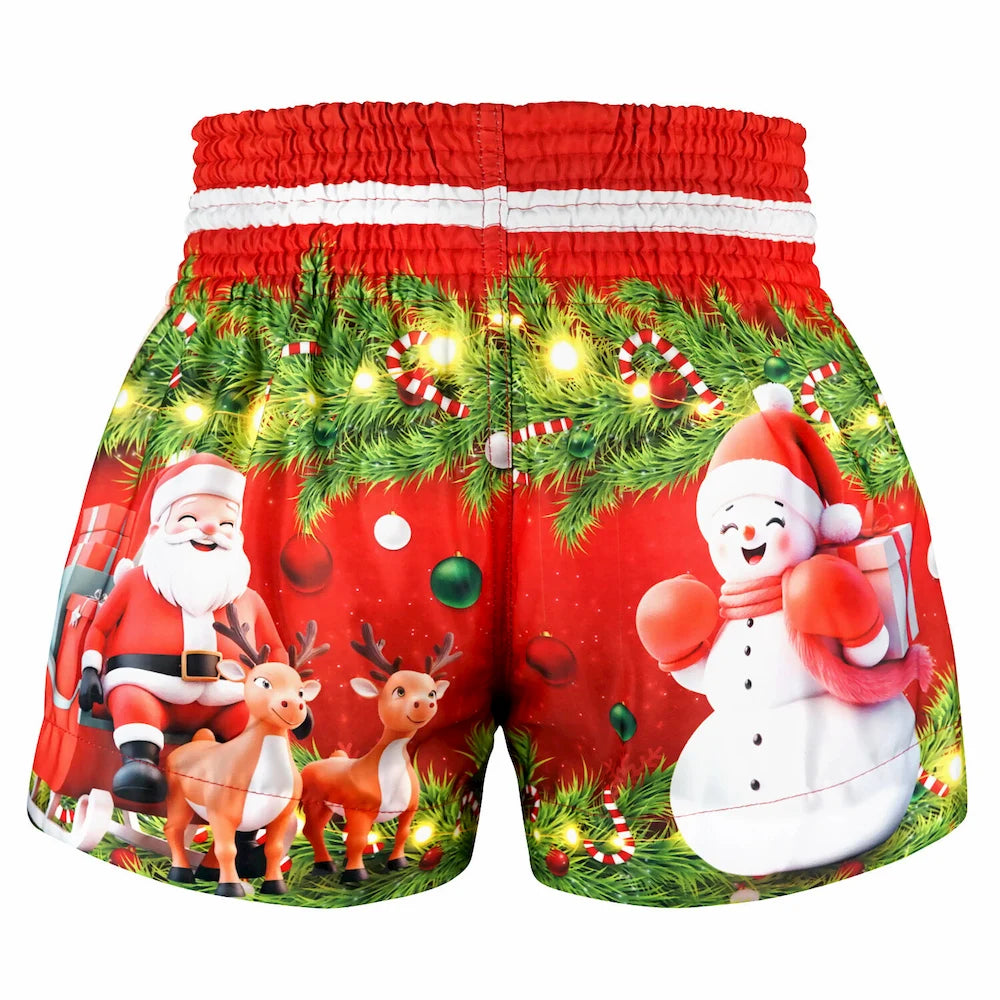 Christmas-themed Muay Thai shorts with Santa Claus, reindeer, and snowman on a red background