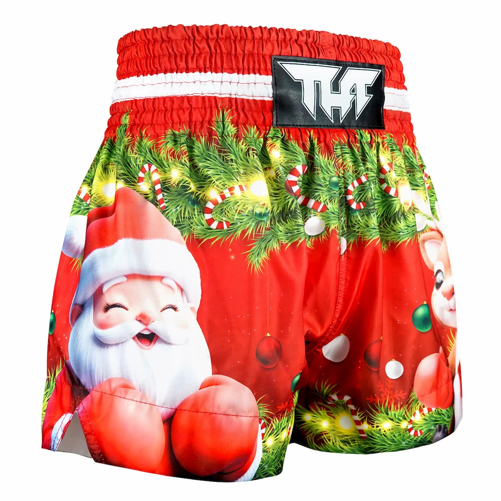 Red boxing shorts with Christmas-themed design featuring Santa Claus and festive elements on a white background.