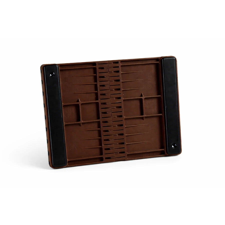 Brown plastic breaking board with padding on a white background