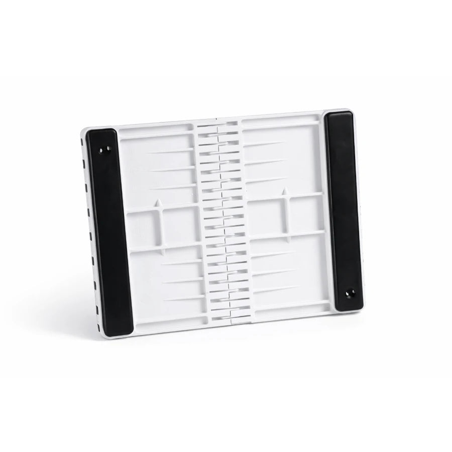 White plastic breaking board with padding on a white background