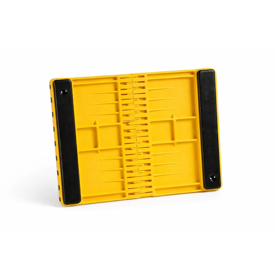 Yellow plastic breaking board with padding on a white background