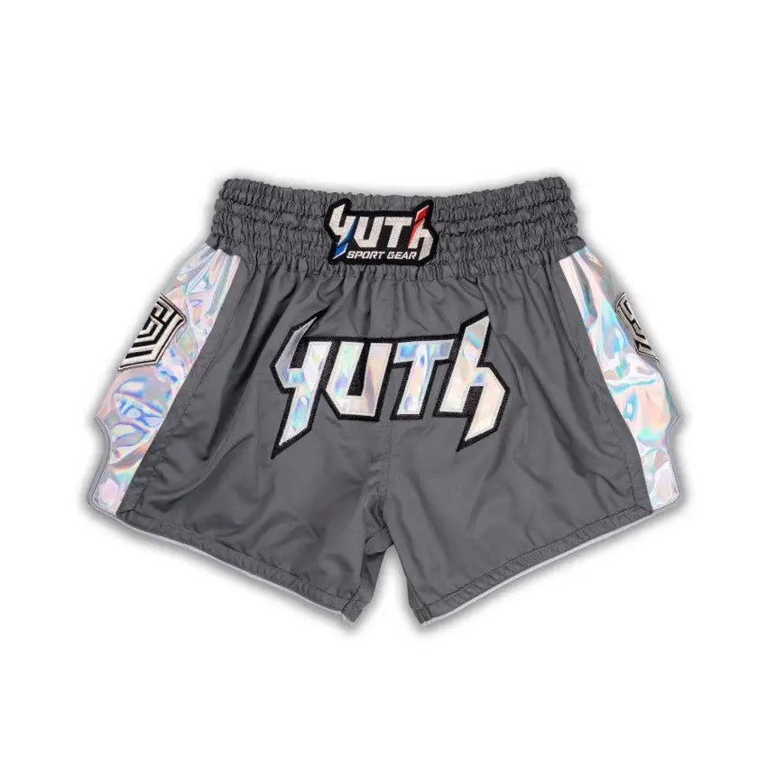 Gray Muay Thai shorts with colorful side panels and 'YUTH' branding on a white background