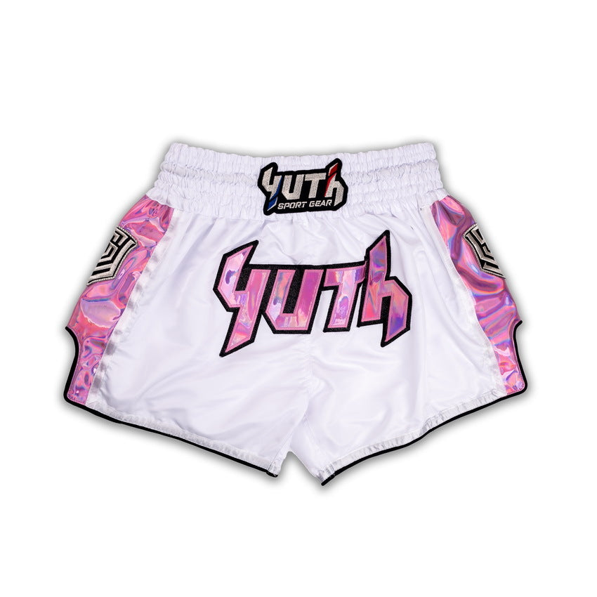 White athletic shorts with pink and black designs on a white background