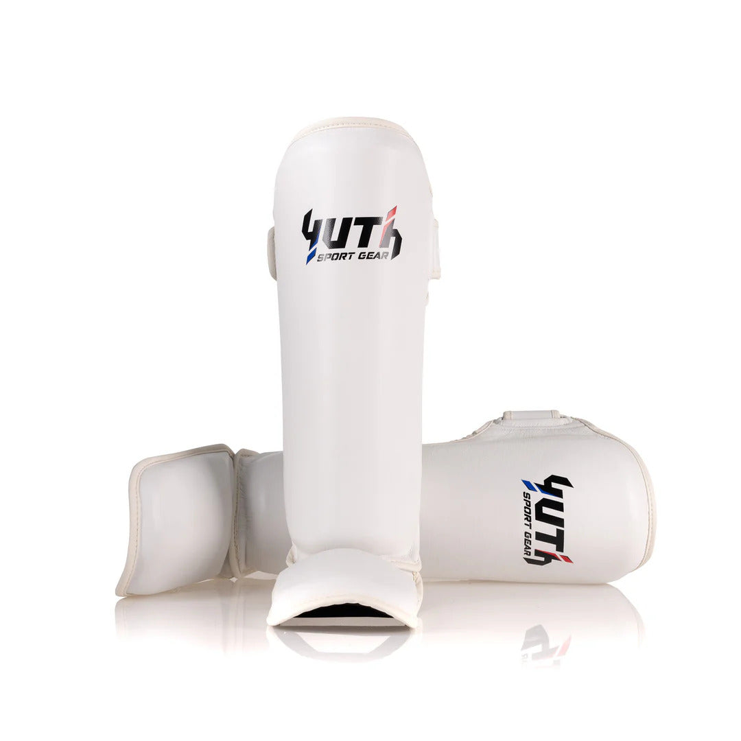 White shin guards with YUTH SPORT GEAR branding on a white background