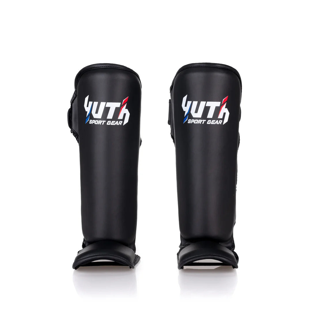 Pair of black shin guards with Yuth Sport Gear logo on a white background