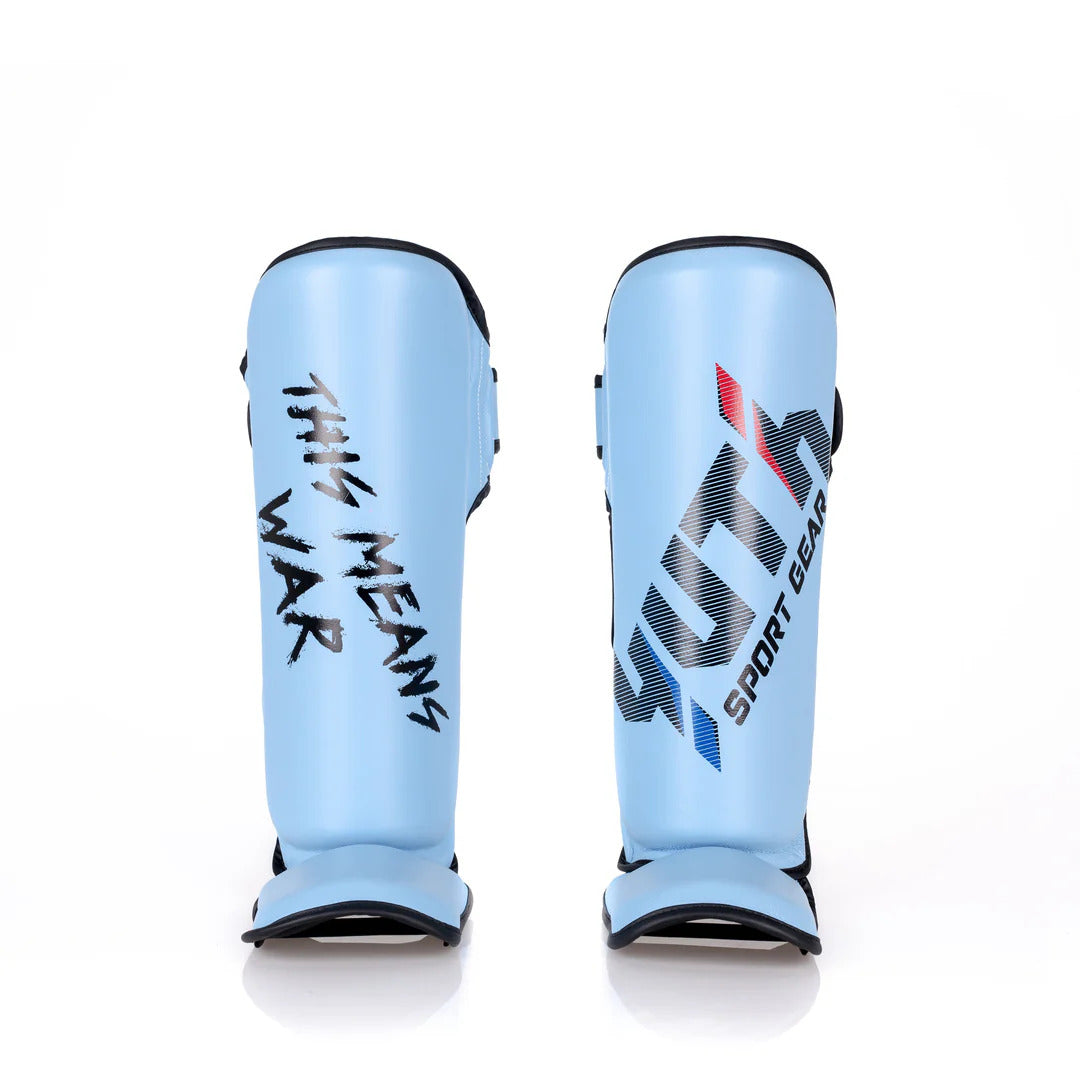 Light blue shin guards with black text on a white background