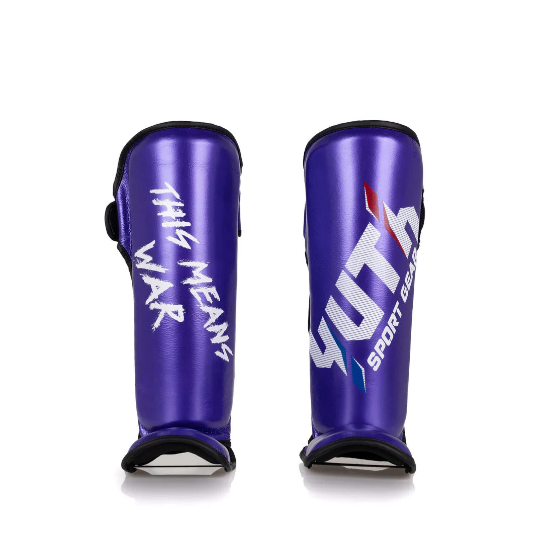 Purple shin guards with white text on a white background