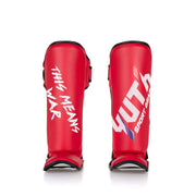 Red shin guards with white text on a white background
