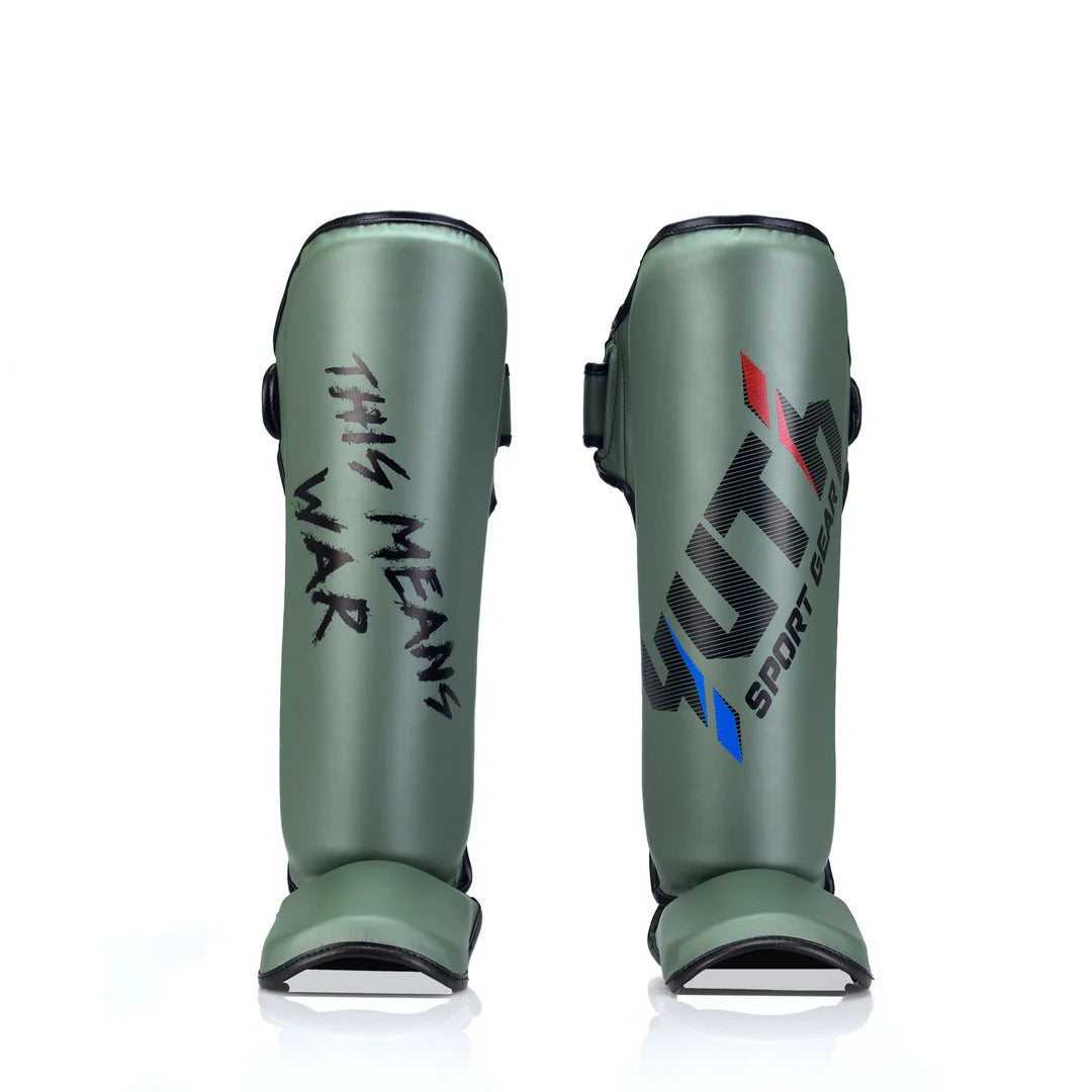 Green shin guards with text and branding on a white background