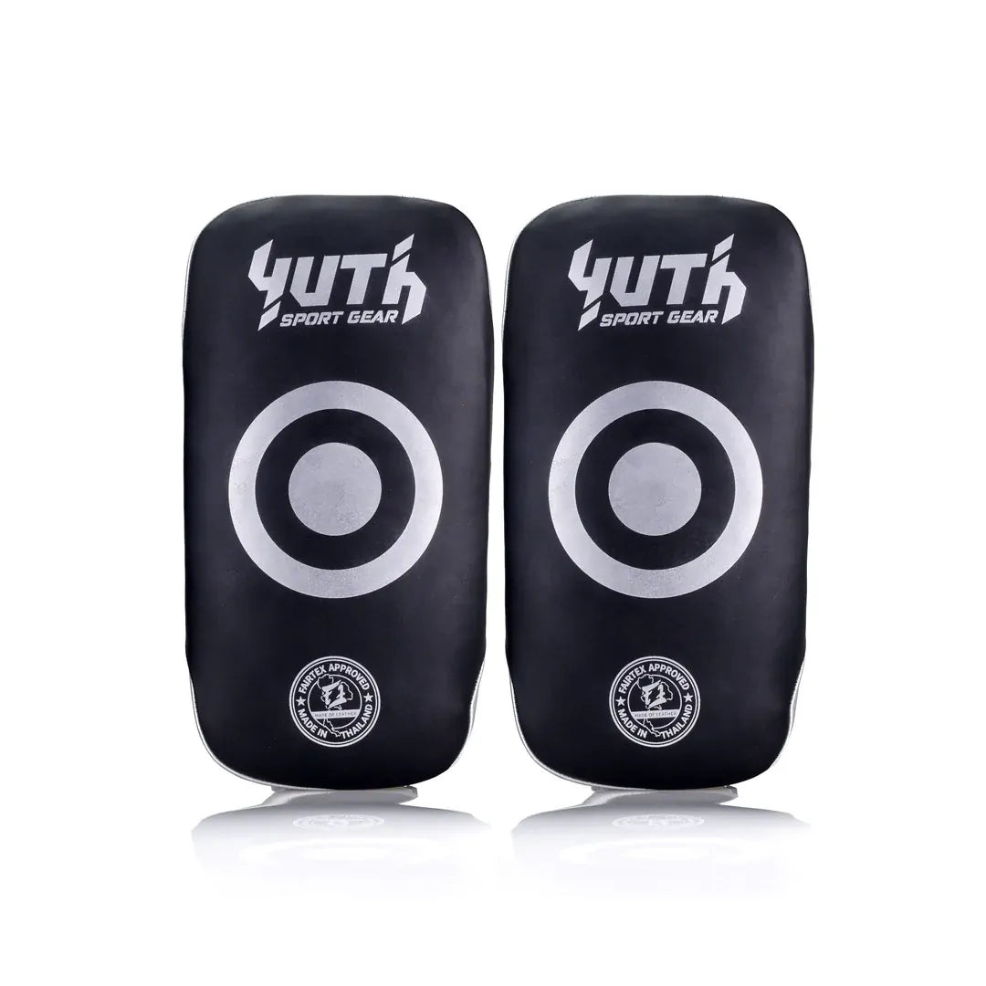 Pair of black thai pads with white circular targets and 'Yuth Sport Gear' branding on a white background.