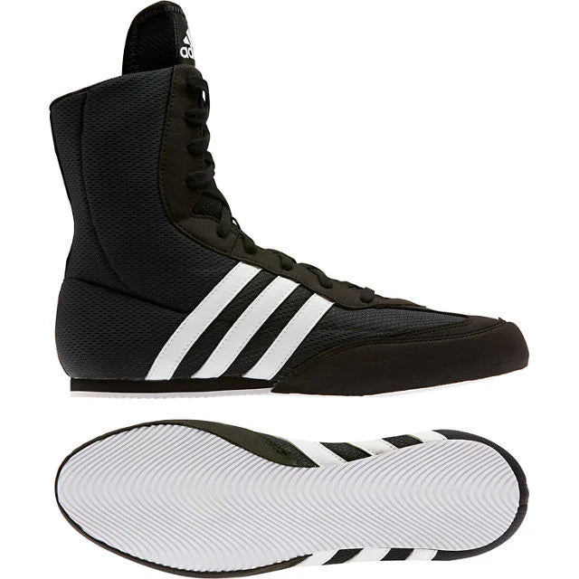 Black Adidas boxing shoes with white stripes on a white background