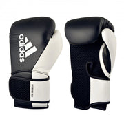 Black and white boxing gloves with Adidas logo on a white background