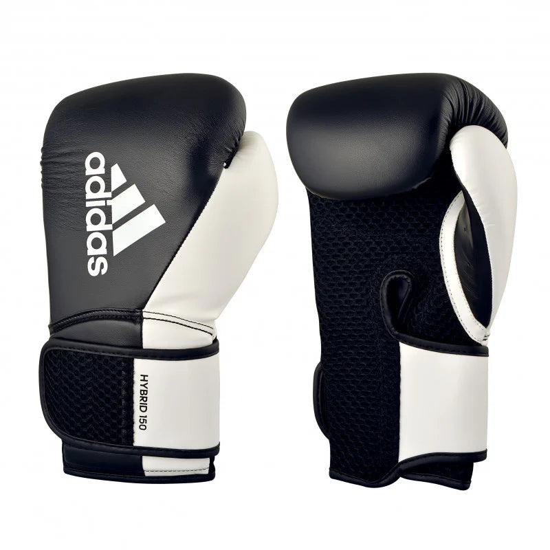 Black and white boxing gloves with Adidas logo on a white background