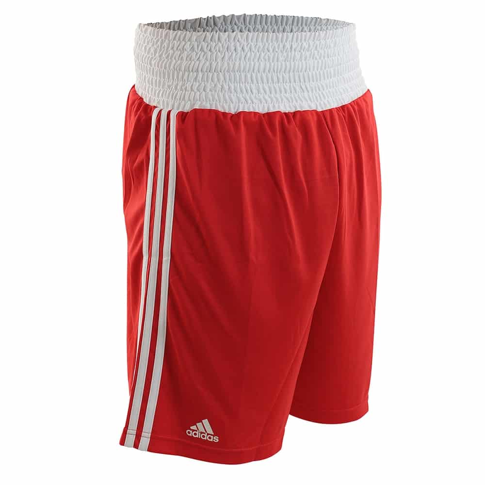 Red shorts with white stripes and Adidas logo on a white background