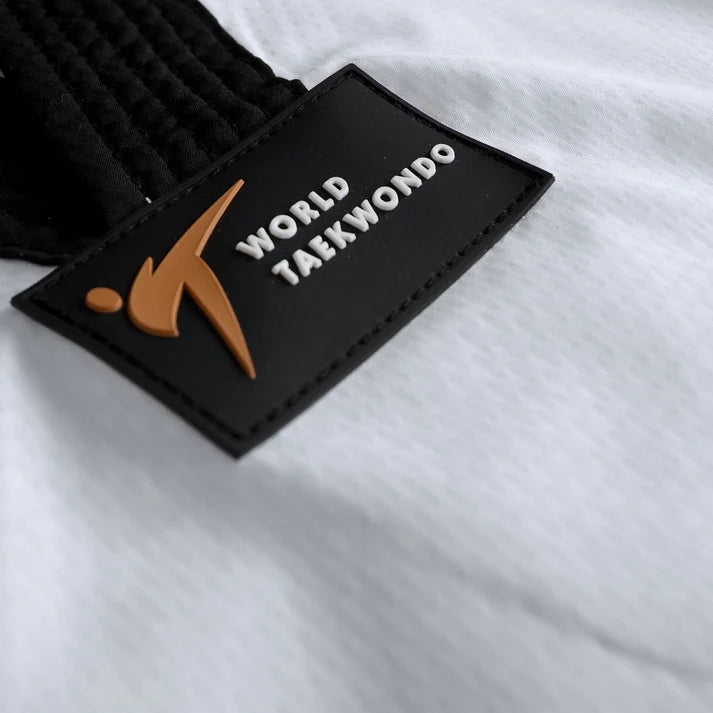 Black and orange patch with 'World Taekwondo' text on a white background