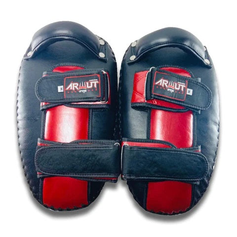 Pair of black and red Muay Thai pads with 'Arwut' branding on a white background