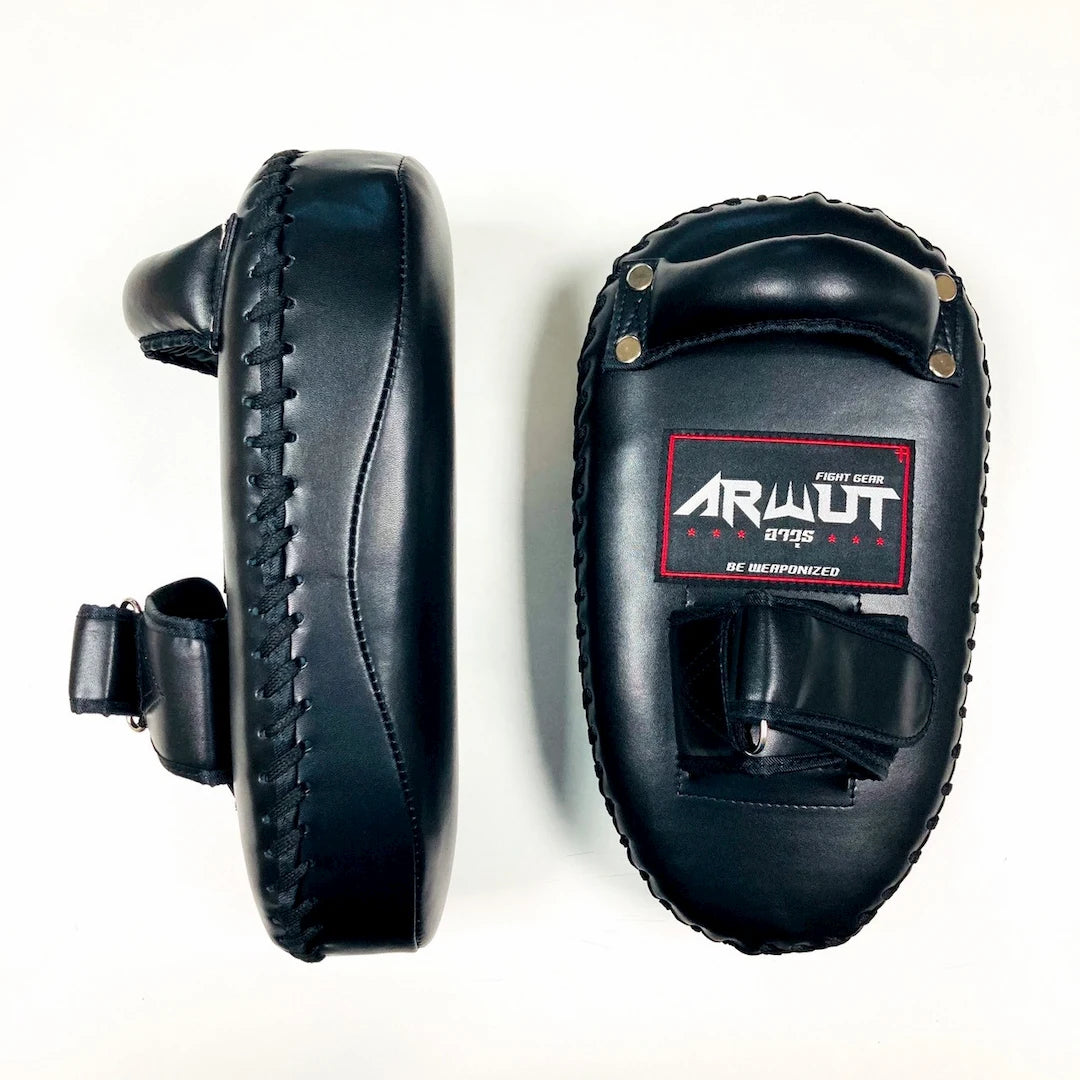 Black Muay Thai pads with a brand label on a white background