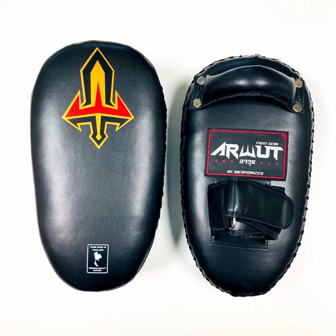 Black Muay Thai pads with a logo and brand name on a white background