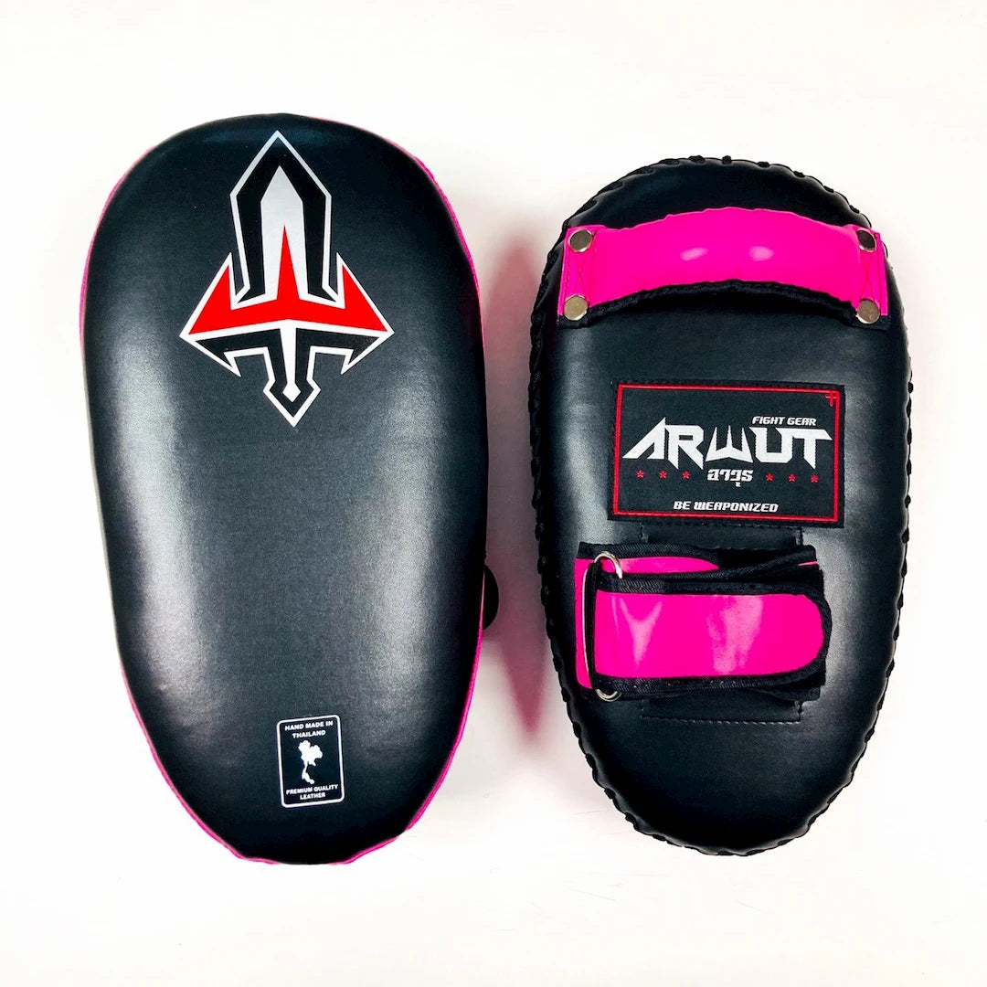 Pair of black and pink Muay Thai pads with visible branding on a white background