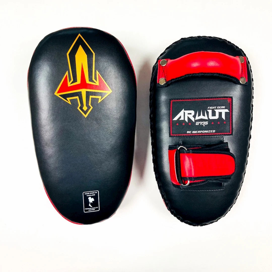 Pair of black and red Muay Thai pads with a visible brand logo on a white background.
