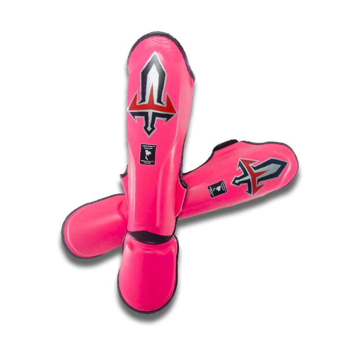 Pink Muay Thai shin guards with a logo on a white background