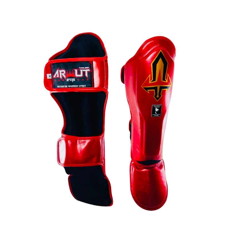 Red and black Arwut shin guards with brand logo on a white background