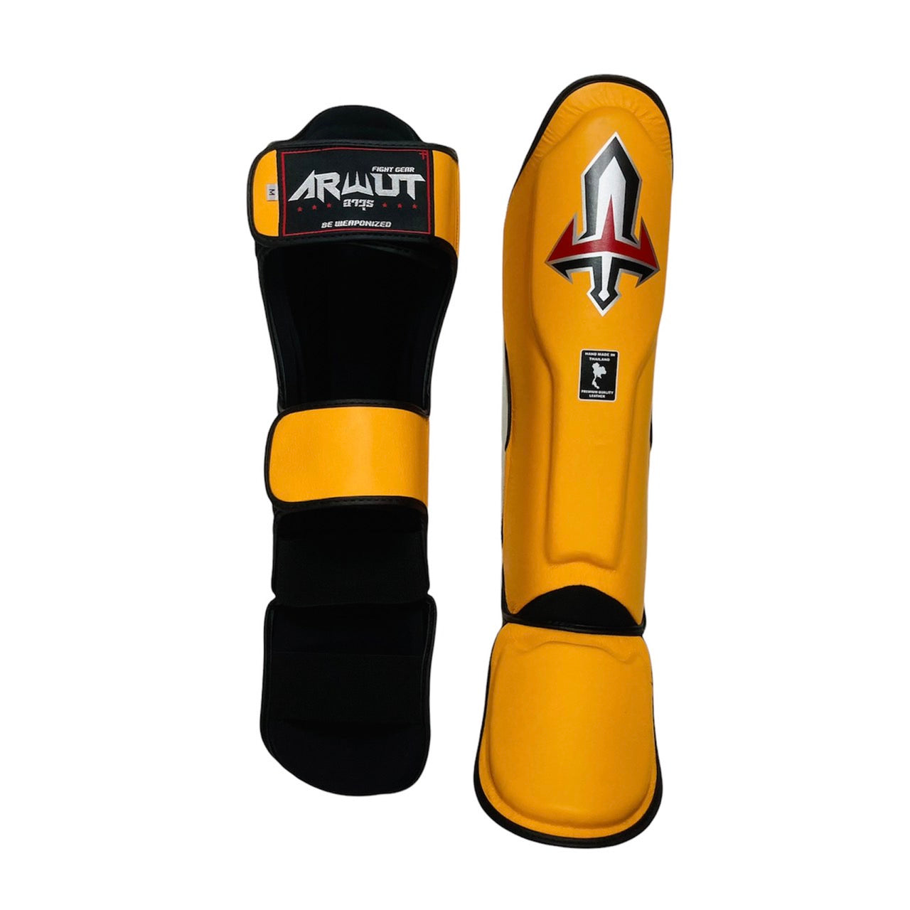 Pair of yellow and black Arwut shin guards with a brand logo on a white background