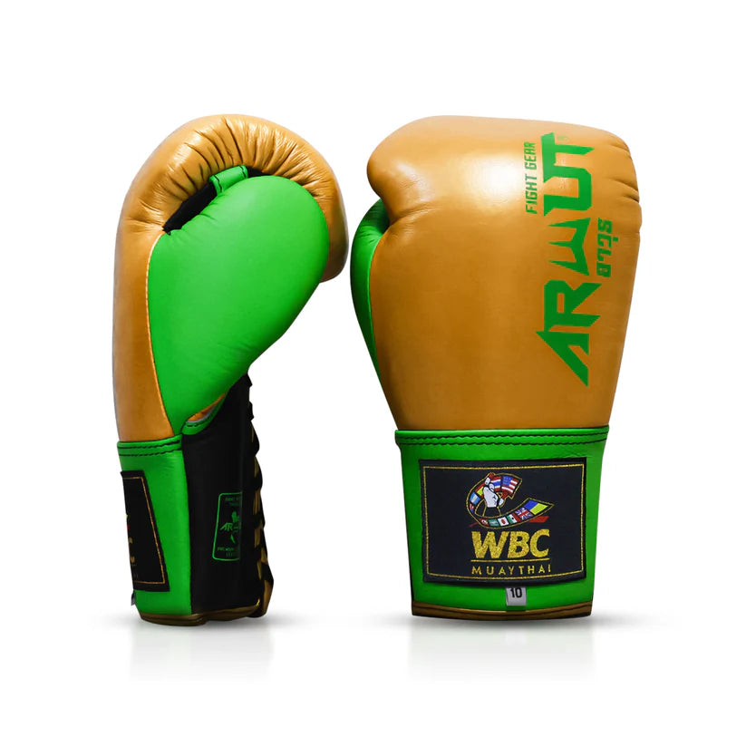 Green and gold boxing gloves with WBC Muay Thai logo on a white background