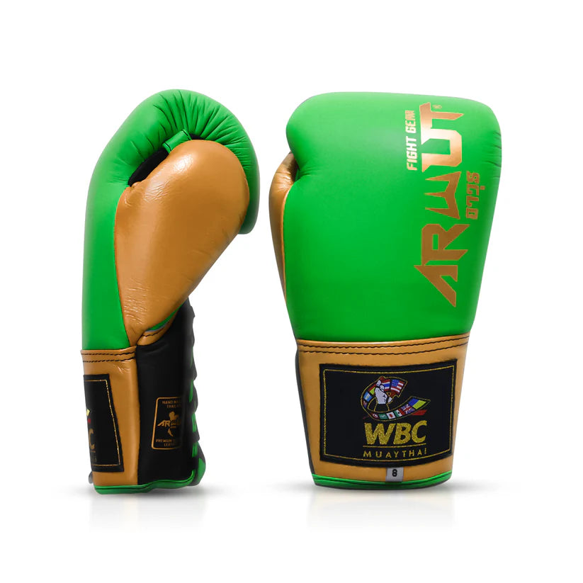 Green and gold boxing gloves with WBC logo on a white background