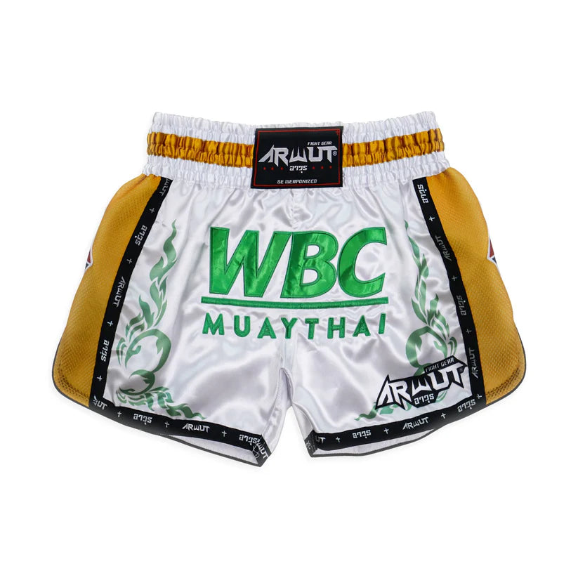 White Muay Thai shorts with green text and yellow accents on a white background