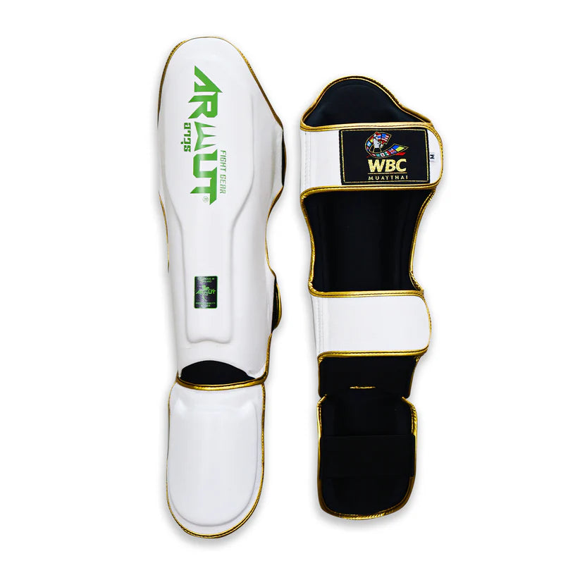 Pair of white and black shin guards with 'Arwut' branding on a white background