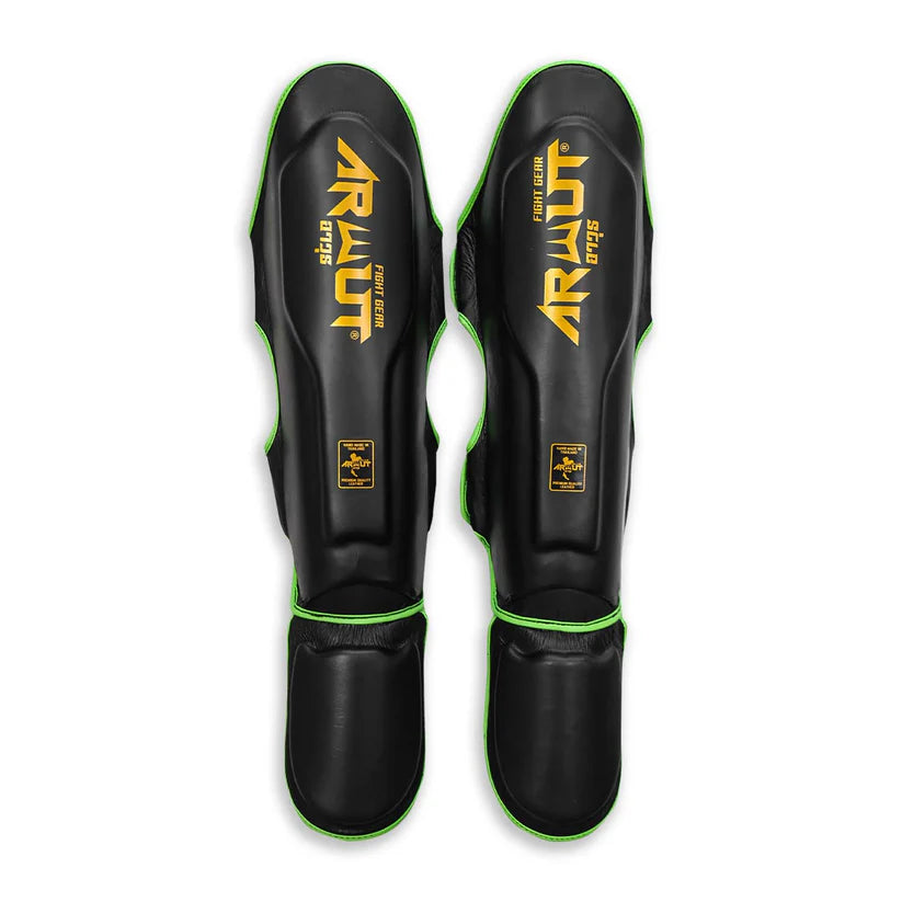 Pair of black shin guards with green accents and 'Arwut' branding on a white background.