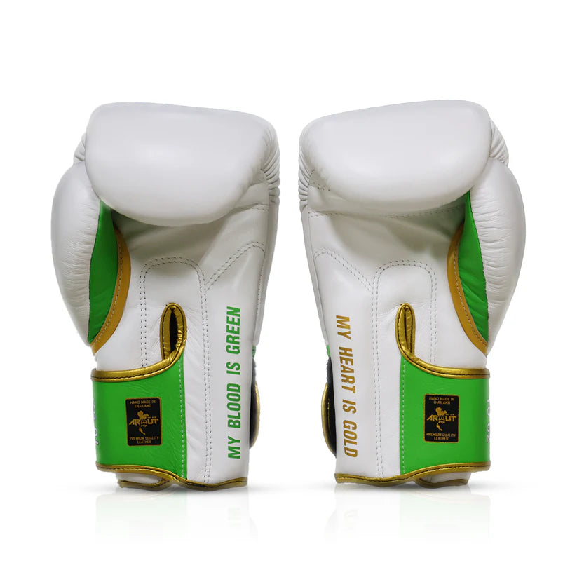 White boxing gloves with green and gold accents on a white background