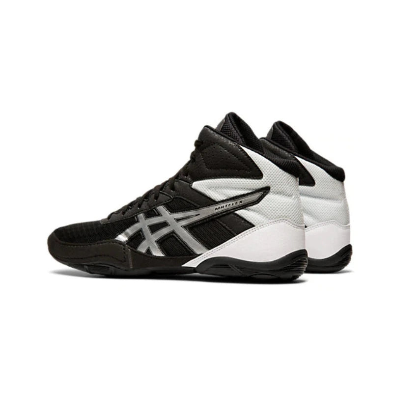 Black and white wrestling shoes on a white background