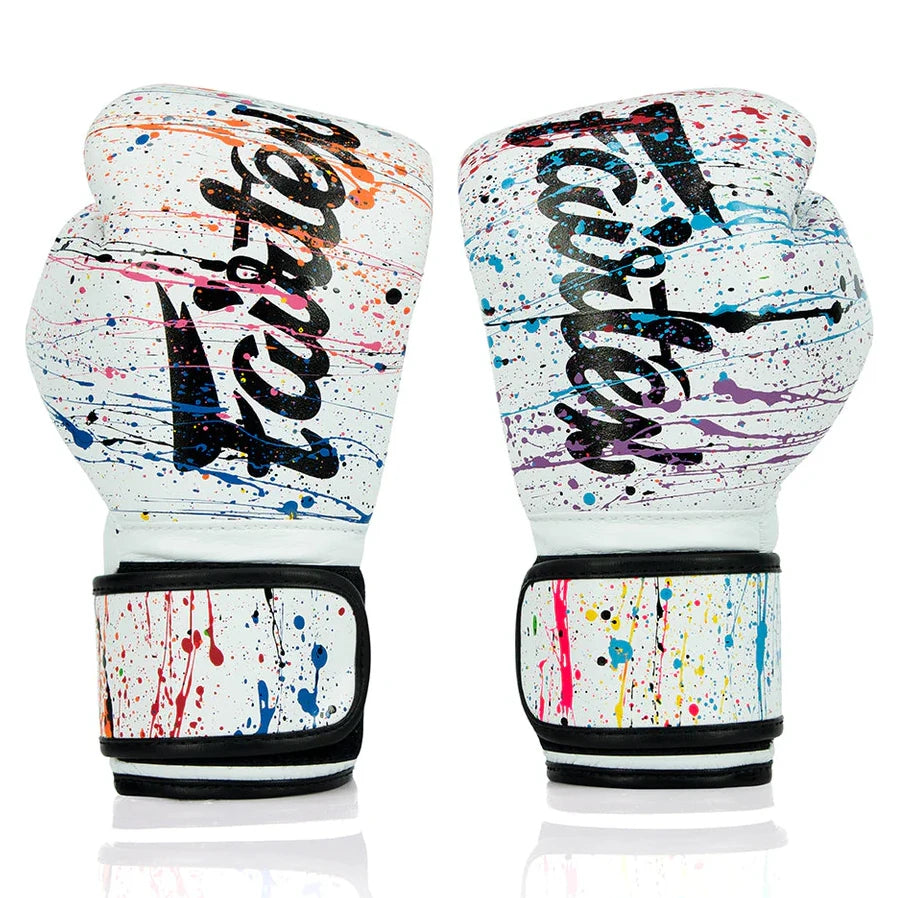 Pair of colorful boxing gloves with 'Fairtex' branding on a white background