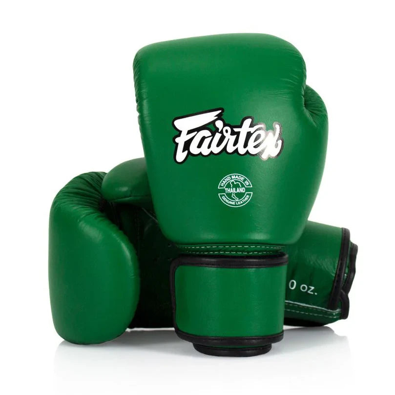 Green boxing gloves with 'Fairtex' branding on a white background