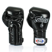 Pair of black boxing gloves with Fairtex logo on a white background
