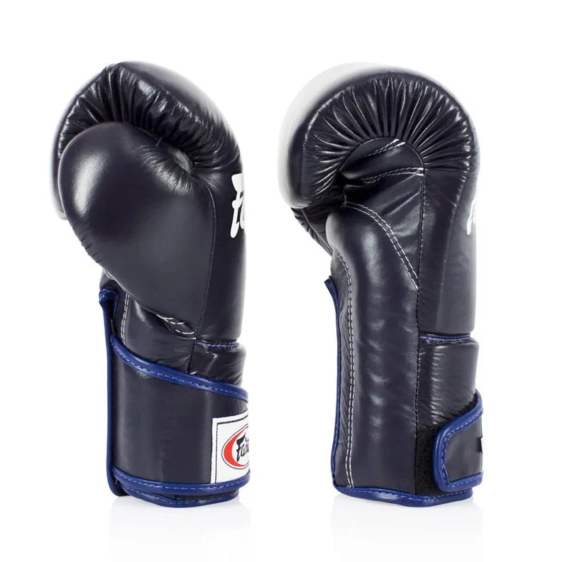 Pair of navy blue boxing gloves with blue accents on a white background