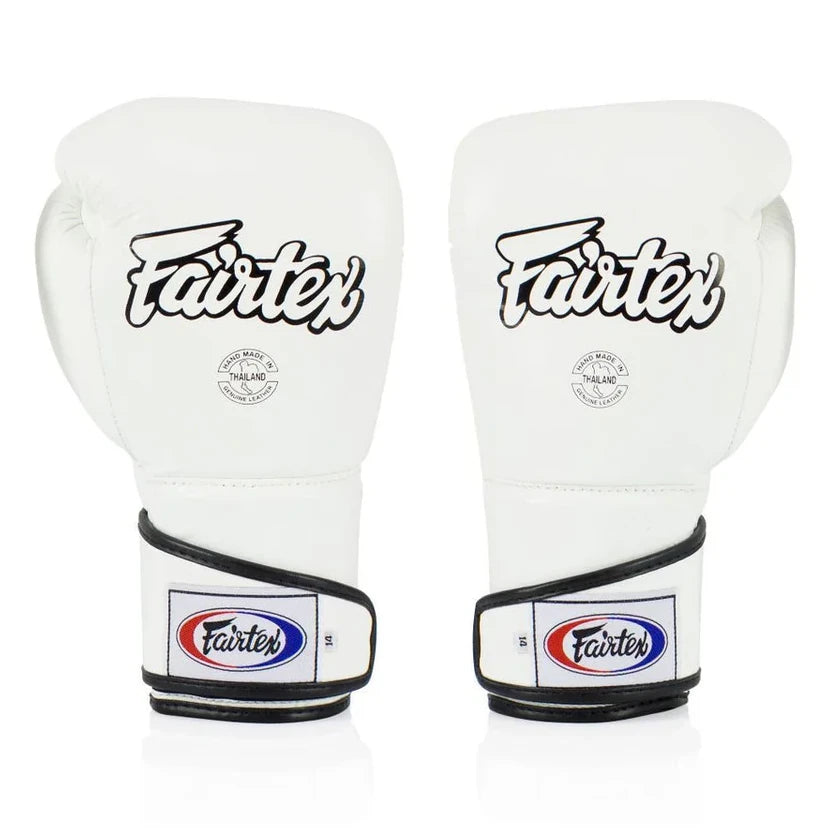 Pair of white boxing gloves with Fairtex branding on a white background